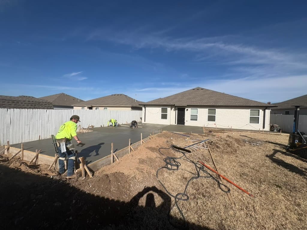 Fresh concrete pour for driveway extension completed by Complete Dream Remodeling in OKC